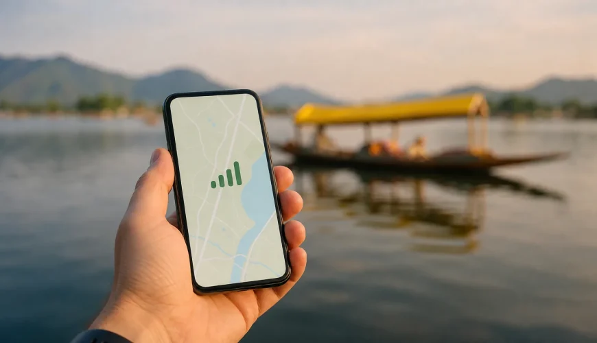 A tourist checking phone signal near Dal Lake in Srinagar, showing mobile network coverage in Kashmir